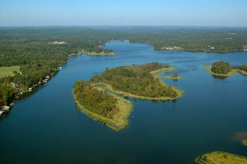 An aerial view of Lake Mackintosh surrounded by lush greenery. Burlington, North Carolina.