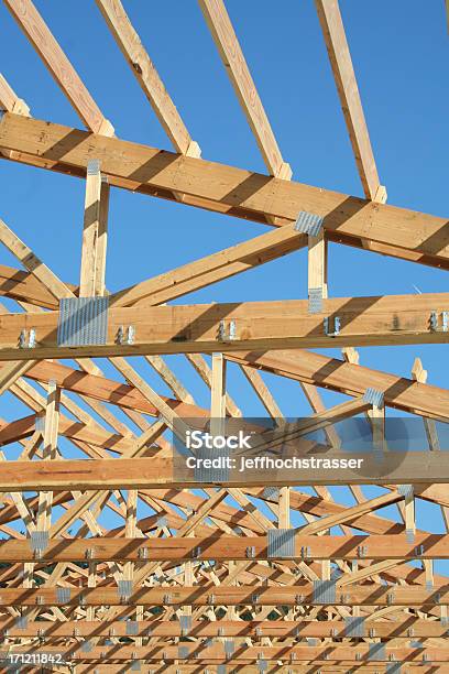 New Home Trusses And Brilliant Blue Sky Stock Photo - Download Image Now - Architecture, Blue, Bright