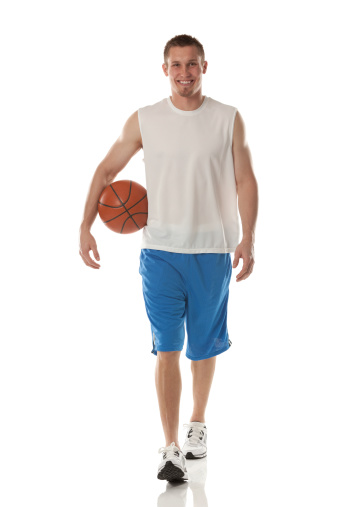 Sportsman carrying a basketball