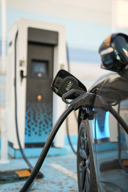 istock electric car connected to charging station for charging 1712127723
