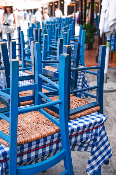 istock Typical greek blue tables and chairs in a restaurant 1712136790