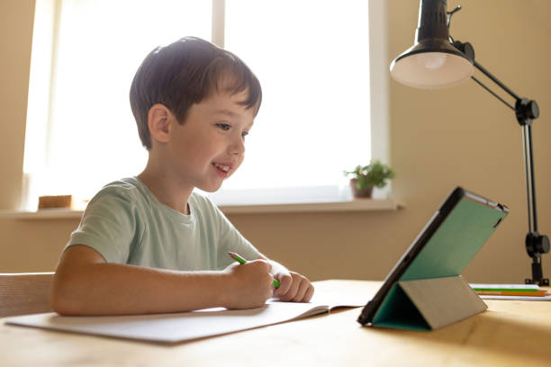 istock A 6 year old boy is studying at home using a digital tablet 1712159912