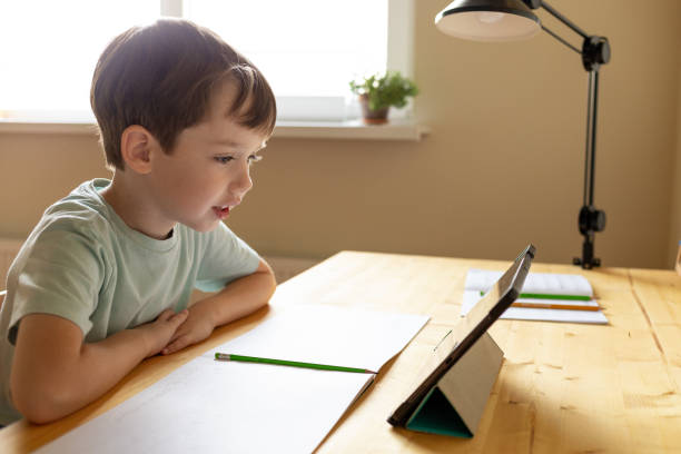 istock A 6 year old boy is studying at home using a digital tablet 1712159914