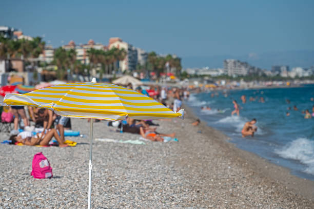 People sunbathing and swimming on the beach. Konyaalt,Antalya,Turkey