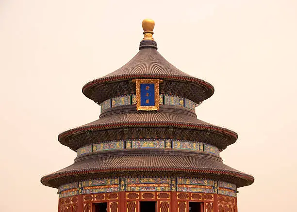 Beijing, China.  Evening light on the Temple of Heaven. This Hall of Prayer for Good Harvests is a triple-gabled circular building, 36 meters in diameter and 38 meters tall,  The building is completely wooden, with no nails.