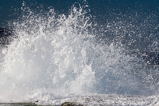 Breaking waves on the rocks near the shore, big splash, Mahe Seychelles 1