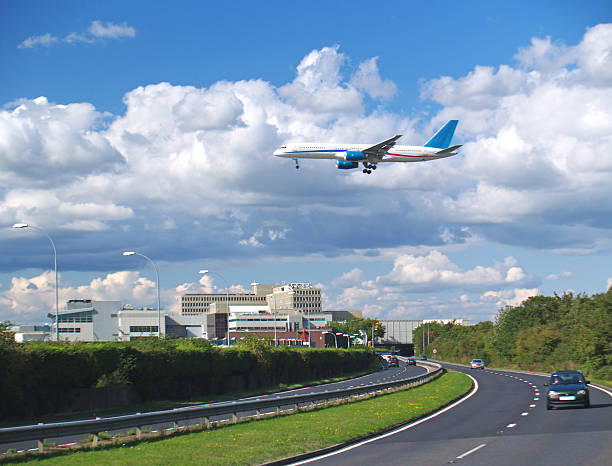 Flight Arrival Aircraft Landing at London's Gatwick Airport. Showing the South terminal and road tunnel. gatwick airport photos stock pictures, royalty-free photos & images