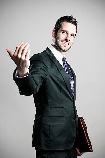 Come on businessman makes with his hand come on, he gesturing an invitation beckoning stock pictures, royalty-free photos & images