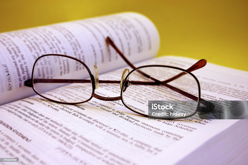 Study Glasses on top of an accounting book.  Shallow depth of field Book Stock Photo