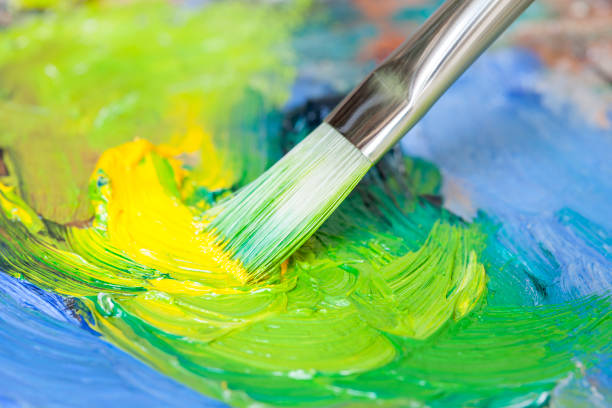 istock Paintbrush with oil paint on a classical palette 171222342