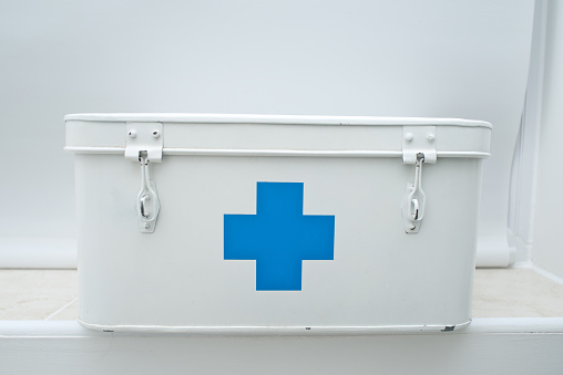 White medical box with a blue cross