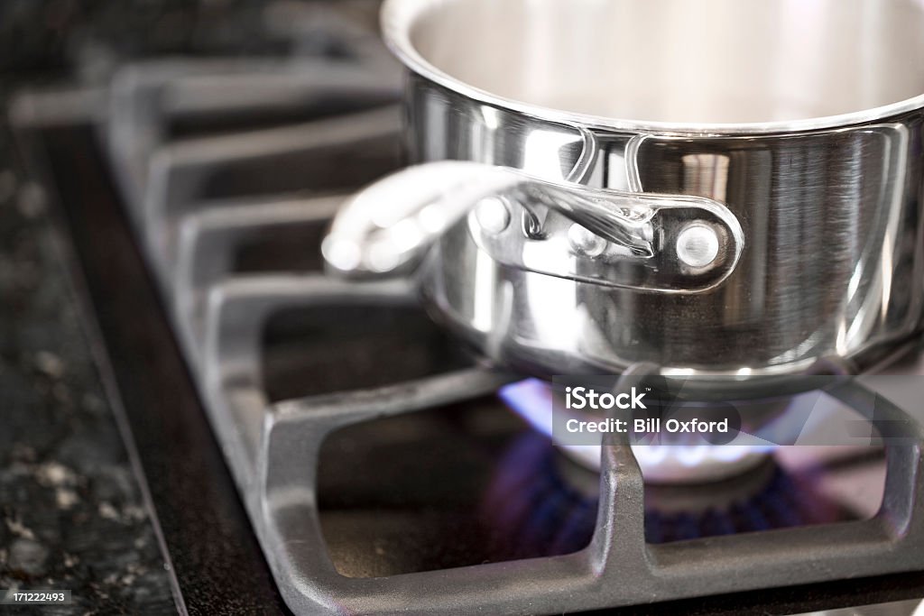 Cooking Pots on gas burner cooking food. Commercial Kitchen Stock Photo