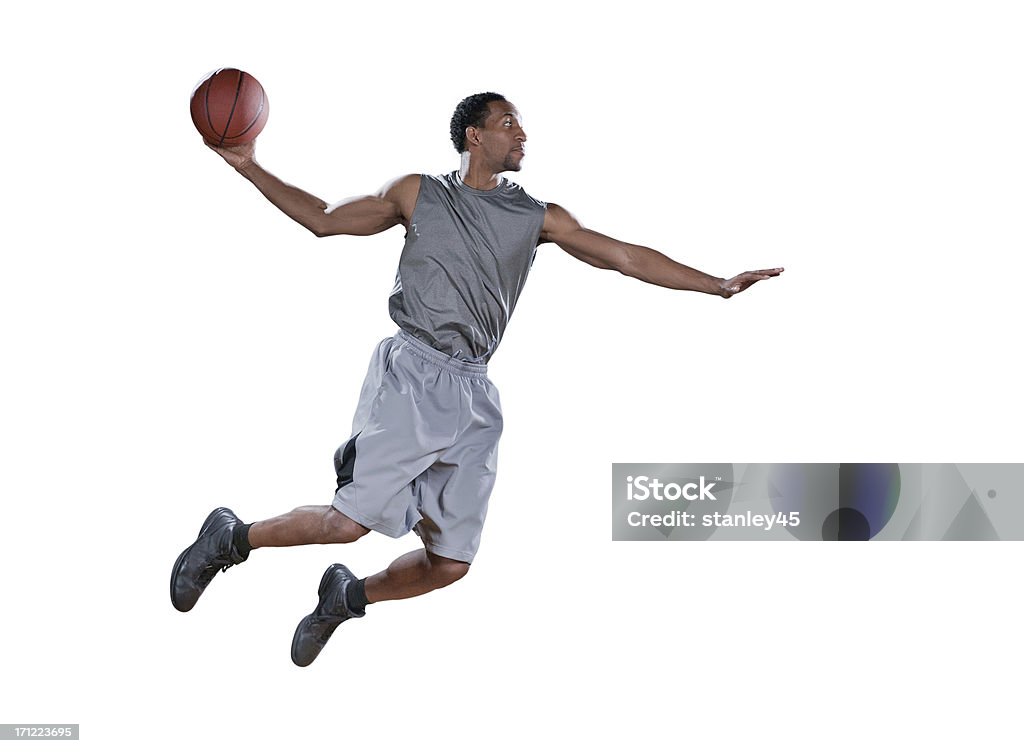 Giocatore di basket in mid-air Fai un jump shot - Foto stock royalty-free di Giocatore di basket