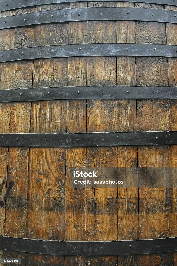 OLD WINE BARREL CLOSEUP Ancient Oak wine barrel with one strap missing Alcohol - Drink Stock Photo