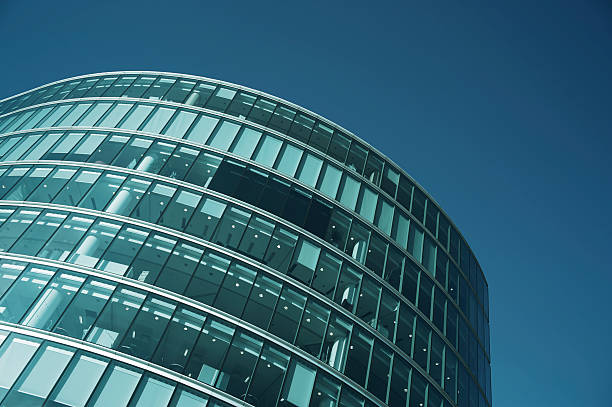 istock Curving Modern Glass Skyscraper Office Tower Blue Sky 171224428