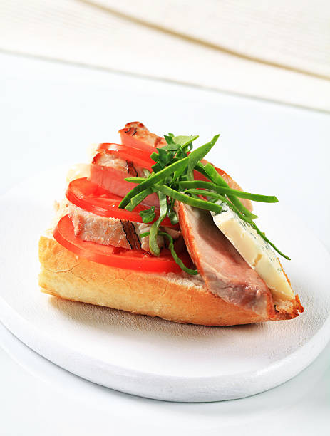 istock Sandwich with meat, cheese and tomatoes 171224450