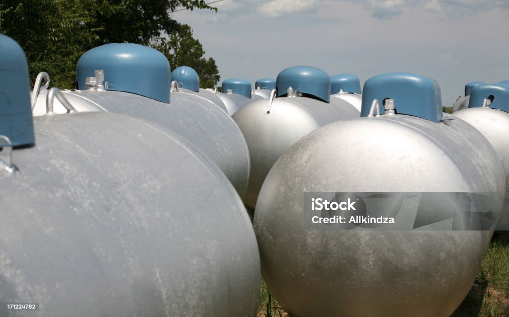 Propane pig parade interesting shot of a bunch of 500 gallon propane tanks Blue Stock Photo