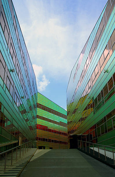 modern building in barcelona. Glass against blue sky with space for text.