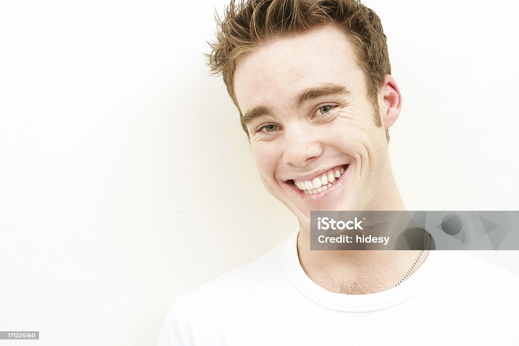 Cheerful and Cheeky Man grinning 20-24 Years Stock Photo