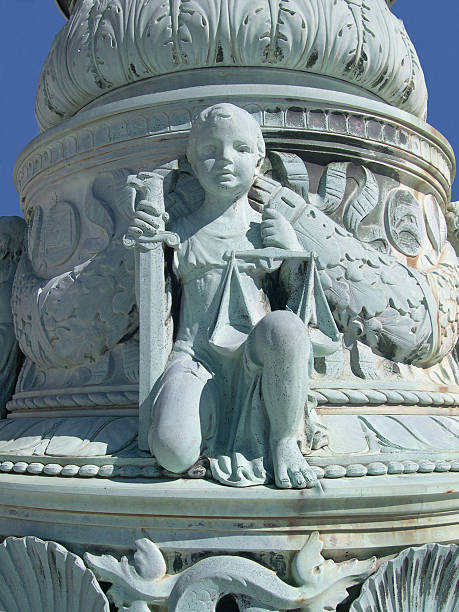 Madrid, Spain - Dec 10th, 2022: Closeup of the monument and fountain to Miguel de Cervantes, in Plaza de Espana (Spain square), Madrid downtown, community of Madrid, Spain, southern Europe. The commemorative monument was designed by the architect Rafael Martinez Zapatero (1865-1937) and the sculptor Lorenzo Coullaut Valera (1876-1932), and was inaugurated on October 13, 1929.