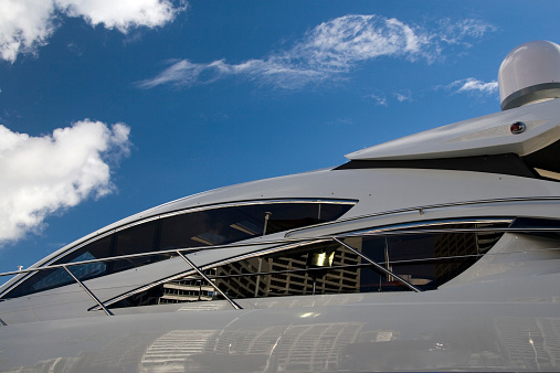 Expensive yacht detail with Sydney skyline reflected in it