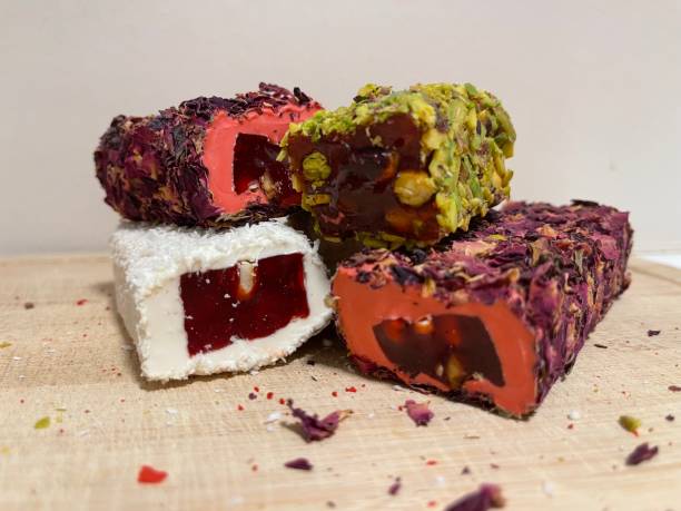 istock Turkish delight with pomegranate and rose, Turkish delight on the board. 1712273476