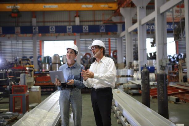 istock worker or engineer working in factory with safety uniform , safety hat and safety glasses , image is safety concept or happy workplace 1712280982