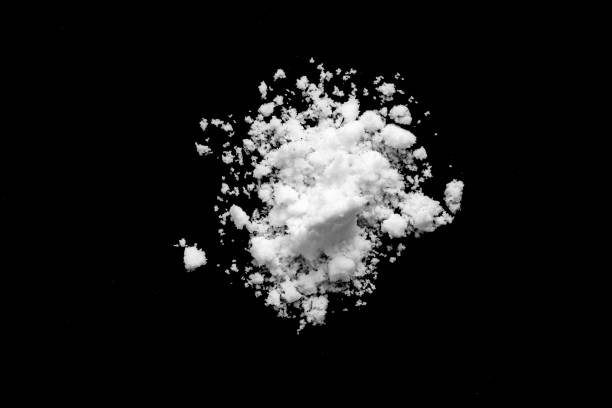 istock White snow isolated on black background close up 1712310453