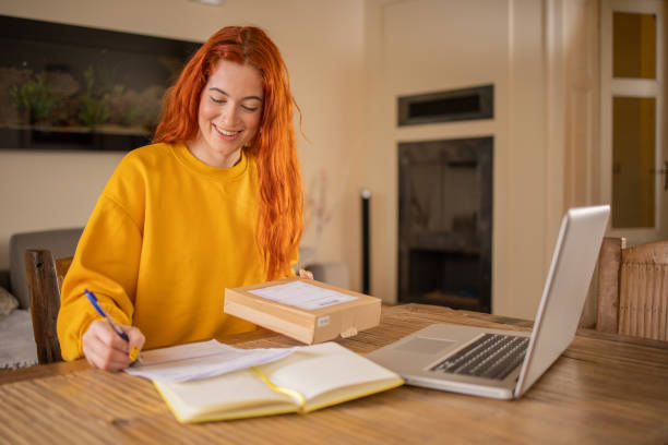 istock Young entrepreneur is sending a package to a customer 1712311038