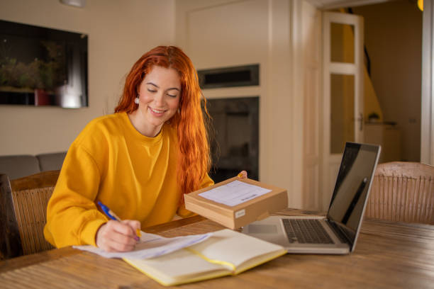 istock Young entrepreneur is sending a package to a customer 1712311075
