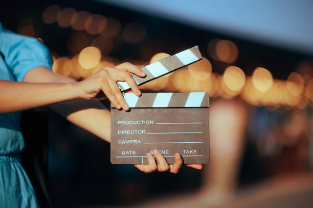 istock Hand Holding a Film Slate Producing a Motion Picture Masterpiece 1712353672