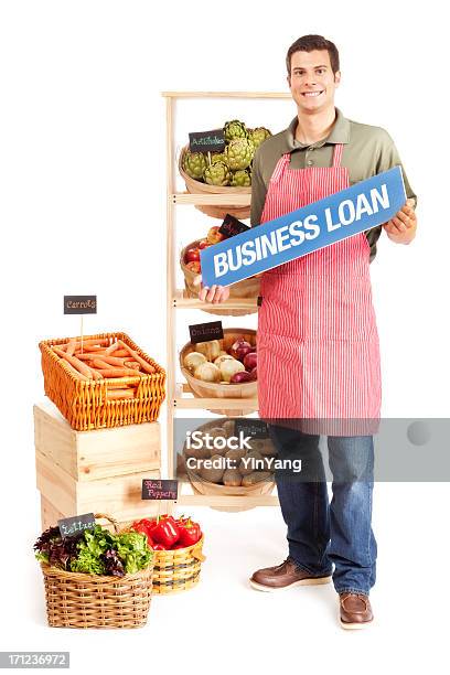 Small Business Grocery Store Owner With Loan Sign Stock Photo - Download Image Now - Men, Selling, Full Length
