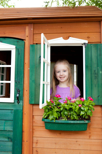 istock Girl in a Playhouse with Flowerbox 171237000