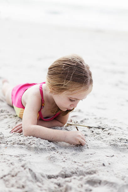istock Girl Playing in the Sand at Beach Vertical 171237071