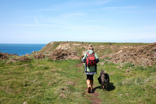 istock Mature woman walking coastal headland 171237501