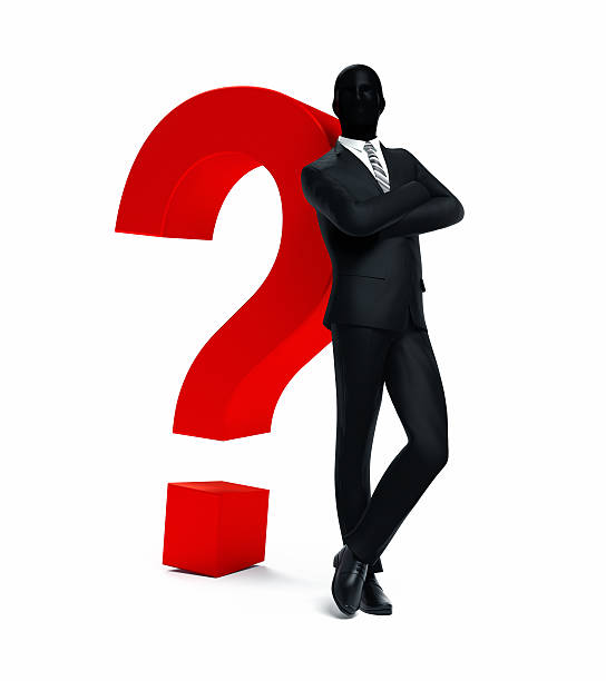 Businessman leaning on question mark stock photo