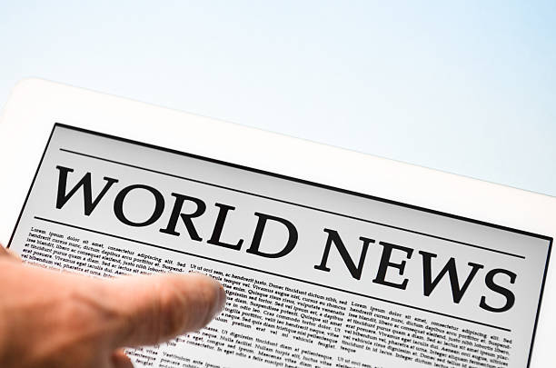 istock man scrolling the newspaper on touch screen digital tablet 171237831