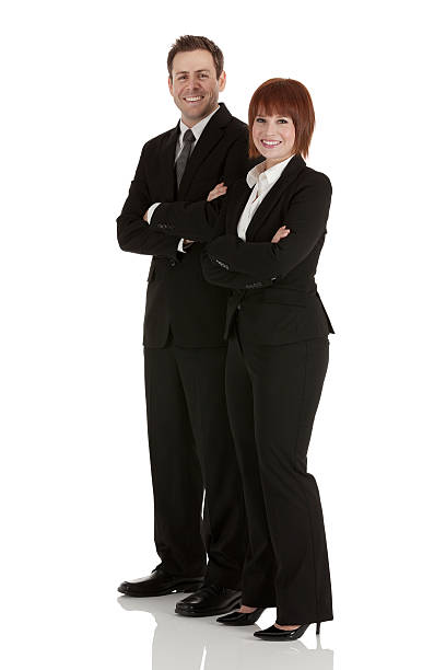 istock Happy business couple standing with arms crossed 171237981