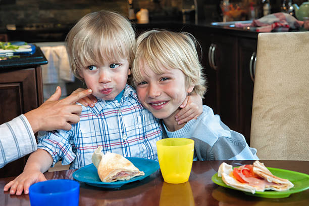 istock Busy lunchtime between three young brothers. 171238135