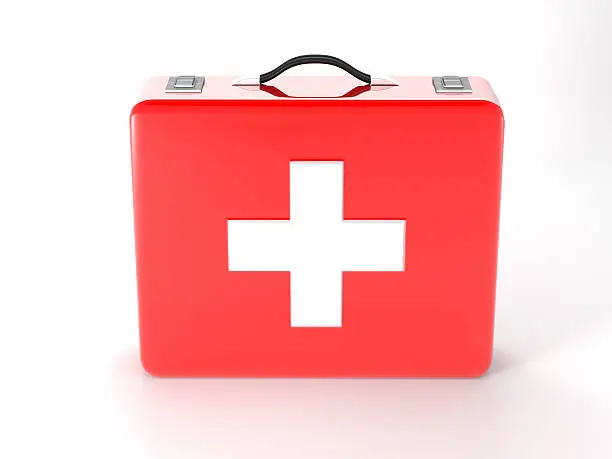 Photo of Red with white cross first aid kit on white background