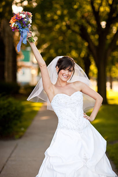 istock Joyful Bride Holding Arm in Air Celebrating  Her Marriage 171238590