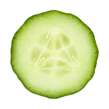 Cucumber circle portion on white background. Clipping path included.