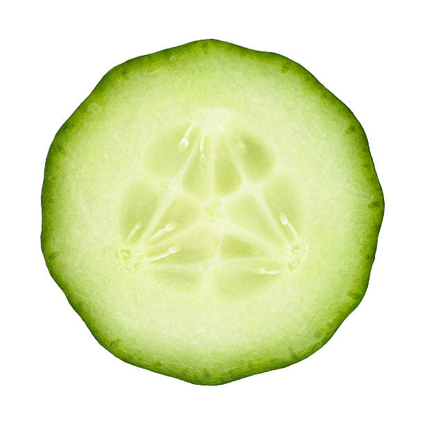 Cucumber portion on white Cucumber circle portion on white background. Clipping path included. vegetables clipping path stock pictures, royalty-free photos & images