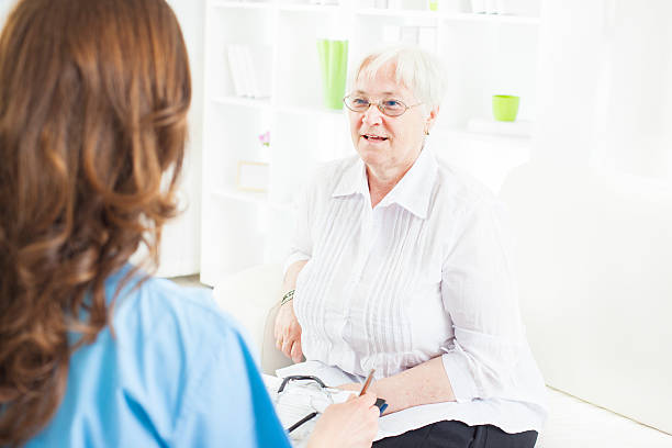 istock Doctor Taking Notes from Senior Woman patient. 171239399