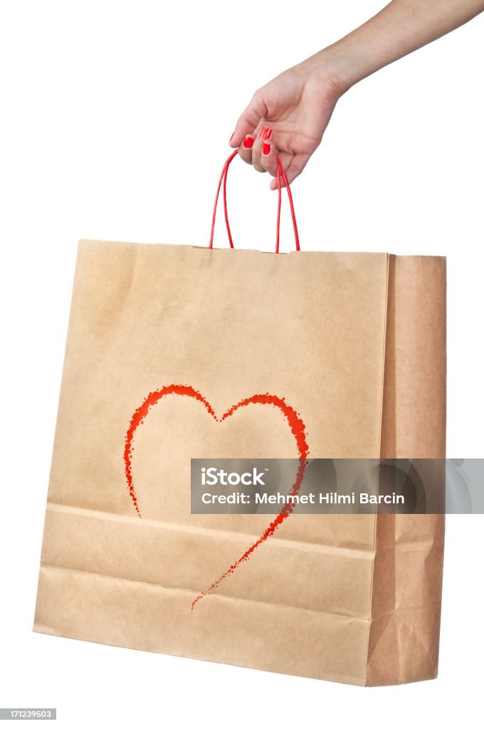 Forma di cuore su shopping bag con Mano umana - Foto stock royalty-free di Busta di carta