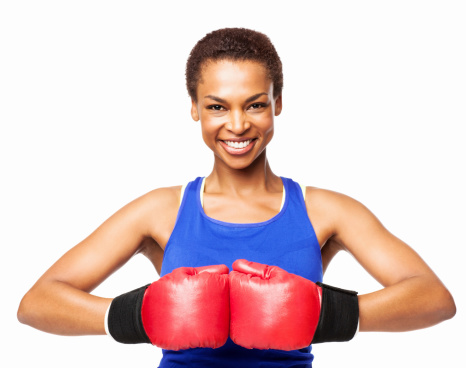 Portrait of a cheerful African American female boxer in boxing gloves. Horizontal shot. Isolated on white.