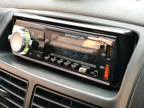 Photo of car dashboard with audio unit.