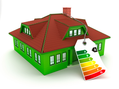 Green house with A grade energy efficiency chart label. Energy efficiency concept.