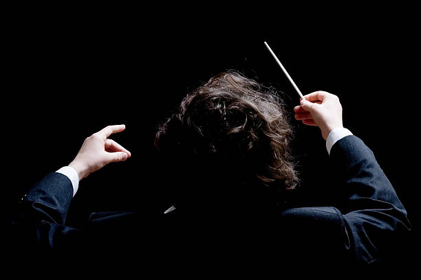 Conductor Conductor's hands with a baton symphony orchestra photos stock pictures, royalty-free photos & images