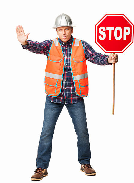 istock Male Construction Worker Holding a Stop Sign - Isolated 171240722